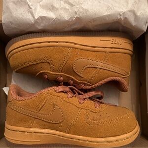 Chestnut color Nike Air Force ones for toddlers, unisex and never worn before.
